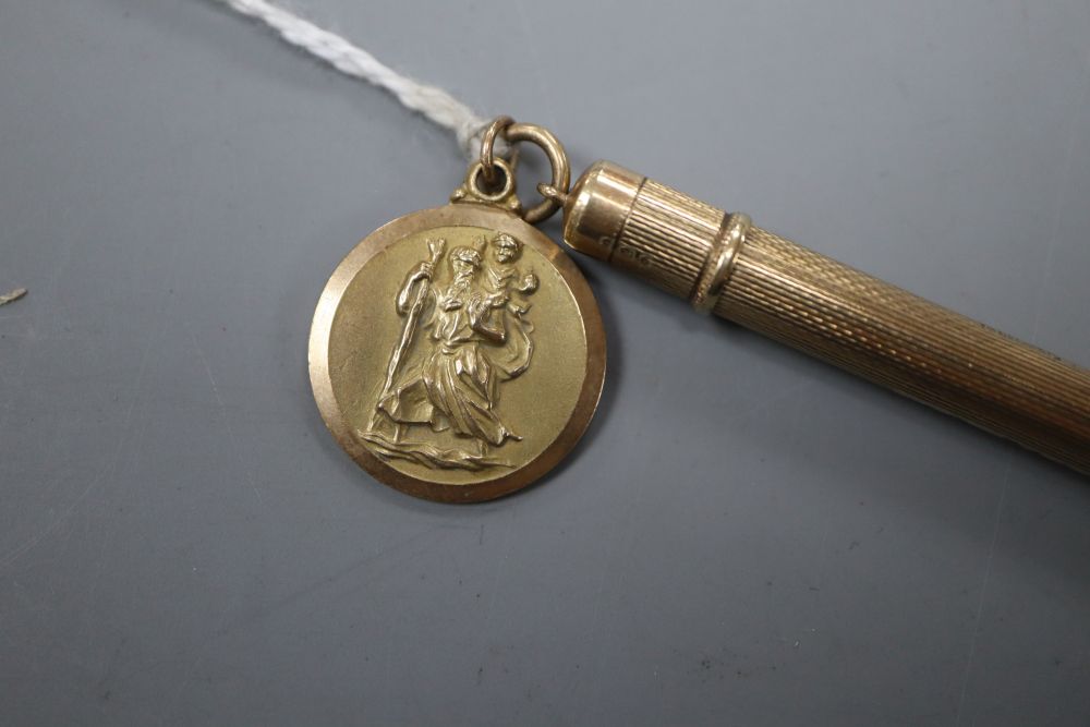 A 9ct gold cased propelling pencil, 87mm and a 9ct gold pendant( 3.2 grams).